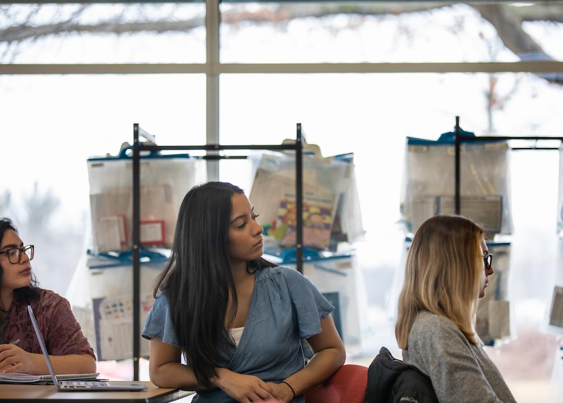 image is of three women learning in a classroom